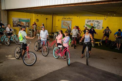 a group of people riding bikes in a garage at Elk Rapids Bungalow Garden Firepit AC in Elk Rapids