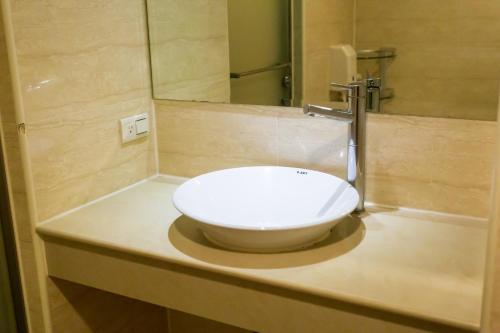 Koupelna v ubytování Newrise Hotel