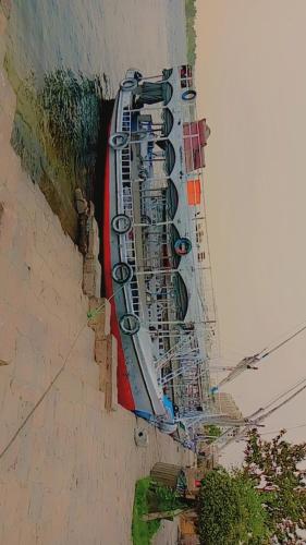 a painting of a row of street signs on a building at Ozzy Tourism in Aswan