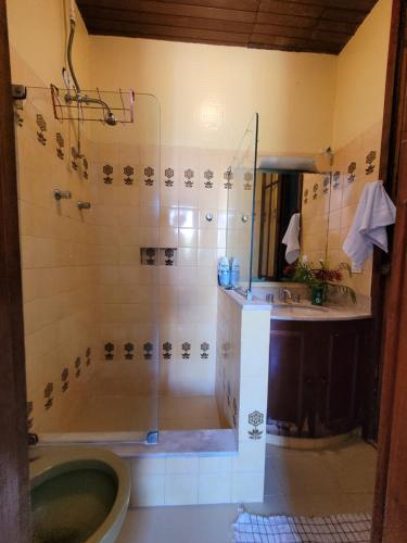 a bathroom with a shower and a tub and a sink at Rio World Connection Hostel in Rio de Janeiro