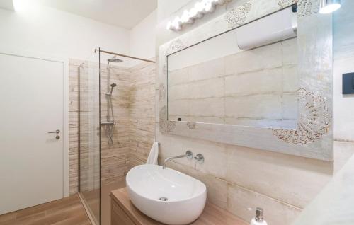 a bathroom with a toilet and a sink and a shower at House with pool Garden in Žrnovnica