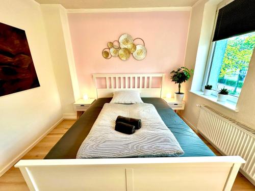 a large bed in a room with at Akram Appartement IV - Nähe Bahnhof in Hildesheim