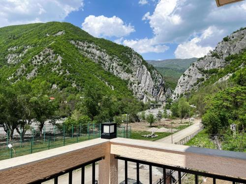 a balcony with a view of a mountain at Khidikari Hotel in Ambrolauri