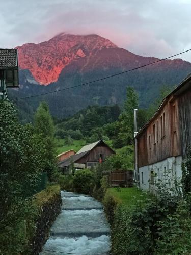 a river with a mountain in the background at Bosruck in Spital am Pyhrn