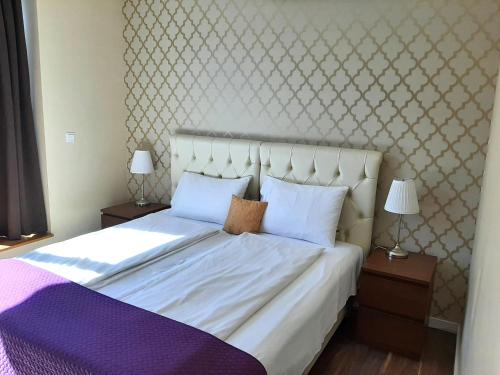 Ένα ή περισσότερα κρεβάτια σε δωμάτιο στο Trendy Deluxe Apartments