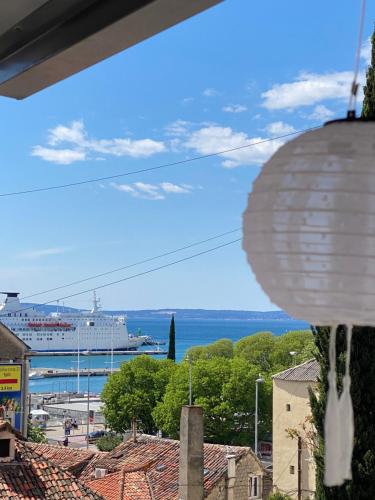 a cruise ship in the water with a city at Apartment Dome in Split