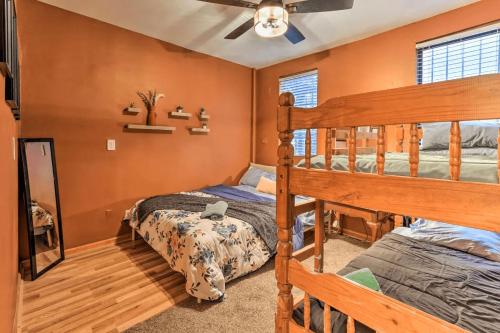 two beds in a bedroom with orange walls at 1850s historic Row House 7min train to NYC with private backyard in Jersey City