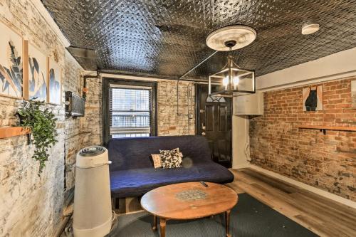 a living room with a couch and a table at 1850s historic Row House 7min train to NYC with private backyard in Jersey City