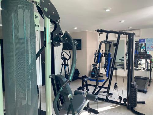 a gym with several tread machines in a room at Apartamento Inteligente, Vista Panorámica! in Cúcuta