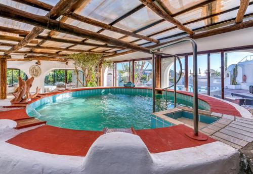 an indoor swimming pool in a house at Villa Ravino Secret Retreat in Ischia