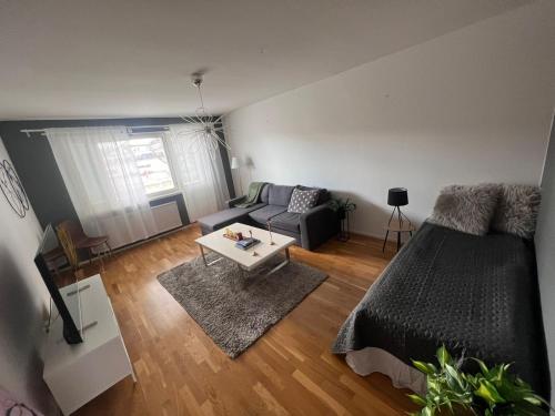 a living room with a bed and a couch at M:Hamn Centrum in Mariehamn