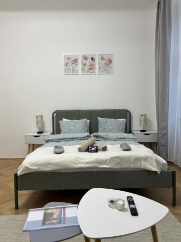 a bedroom with a bed and a table at Apartment Vienna in Vienna