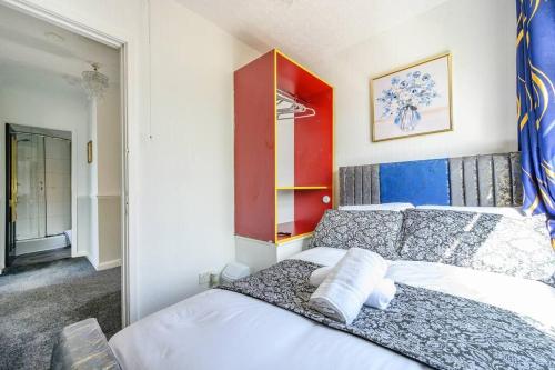 a bedroom with two white beds and a red cabinet at *328OL* For your relaxed & Cosy stay + Parking in Leeds