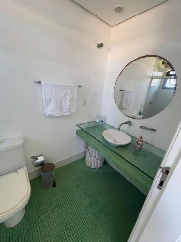 a bathroom with a sink and a mirror at Villa Lele in Salvador
