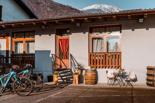 a house with two bikes parked outside of it at Dimora Perla di Villa - Historical Wine Retreat near Bernina Express in Villa di Tirano