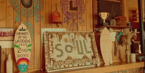 a store shelf with a sign and signs on it at la hacienda 2 bedroom in Ras Sedr
