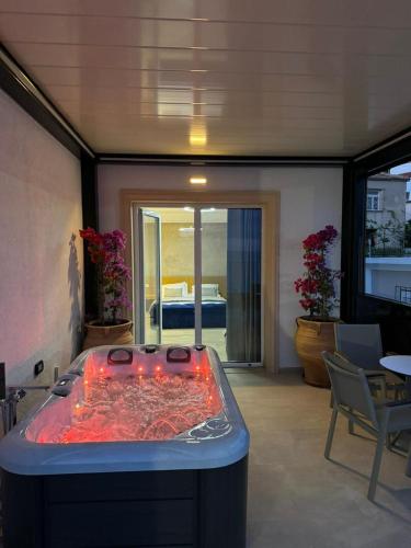 a large hot tub in a living room with at ARXONTIKO in Himare