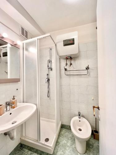 a bathroom with a shower and a toilet and a sink at Glory house Navona Square in Rome