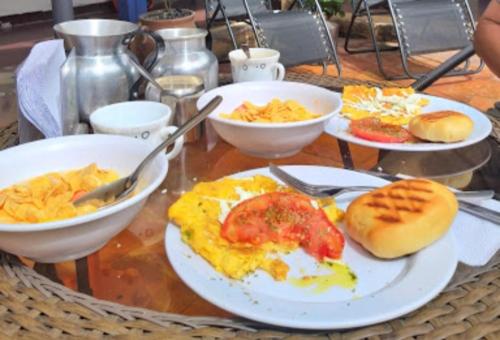a table with plates of breakfast food on it at Vieja Aduana in Zipaquirá