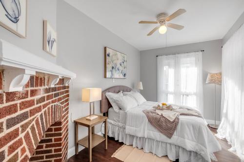 a bedroom with a bed and a ceiling fan at Univ City Upenndrexel 2 Bdrm Lovely Unit in Philadelphia