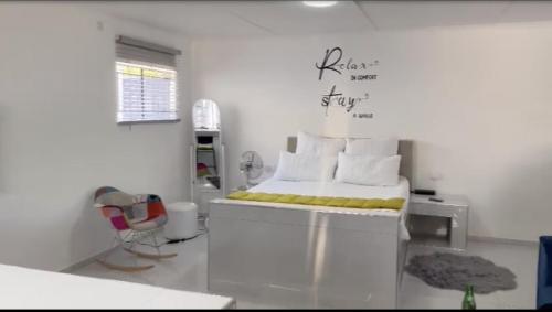 Cama o camas de una habitación en Jomana Luxury Apartments