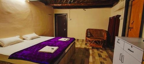Ένα ή περισσότερα κρεβάτια σε δωμάτιο στο Tribal Wood Resort