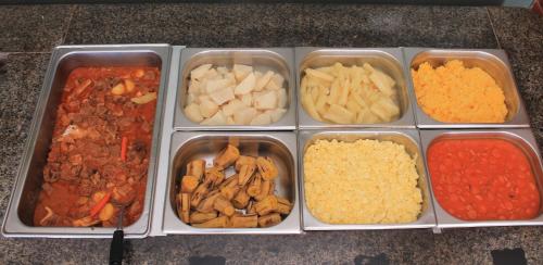 a tray filled with different types of food at Hotel Praia dos Carneiros in Tamandaré