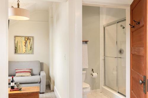 a bathroom with a shower and a couch and a toilet at Sonoma Hotel in Sonoma