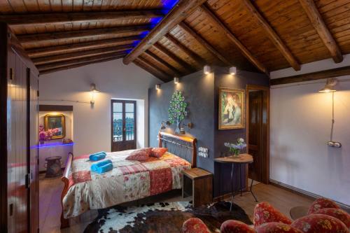 a bedroom with a bed and a couch at II Sogno di Anna & Emma in Ossuccio
