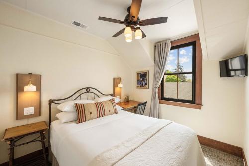 a bedroom with a bed with a ceiling fan at Sonoma Hotel in Sonoma