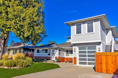 a white house with a white garage at Location, Location, Location-Immaculate 1 Bedroom Suite in Victoria