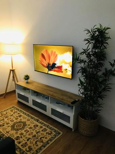 a living room with a flat screen tv on a wall at Casa de Férias MariCeu Mirandela in Mirandela