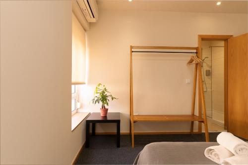 Postel nebo postele na pokoji v ubytování Peach Hostel & Suites