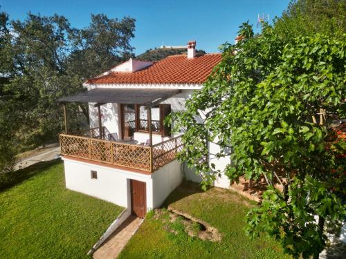 an aerial view of a white house with a balcony at Casas Rurales Los Molinos in Sanlúcar de Guadiana