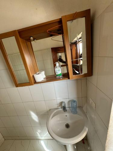 a bathroom with a sink and a mirror at keur manga2 in Somone