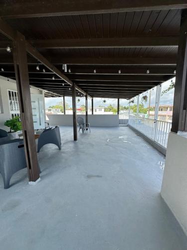 a large patio with a table and bench on a building at Sweet Home in Carolina