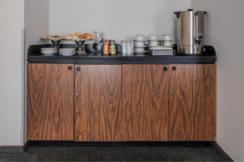 a kitchen with a counter with food on it at City Express by Marriott Queretaro Jurica in Querétaro