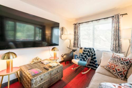 a living room with a couch and a table at Blue Sparrow's Nest in Green Mountain Falls