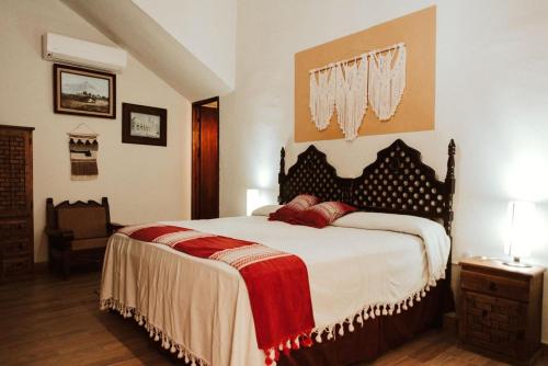 a bedroom with a large bed in a room at Grann Posada Xilitla in Xilitla