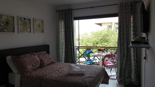 Ένα ή περισσότερα κρεβάτια σε δωμάτιο στο Flat Aconchegante no Monte Castelo