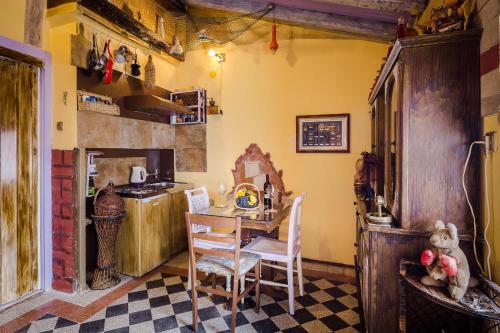 a kitchen with a table and chairs in a room at Guest House Roman Horizon in Split