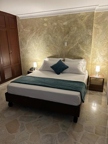 Ένα ή περισσότερα κρεβάτια σε δωμάτιο στο Hotel Ingenio NJ