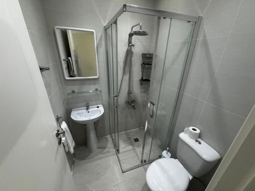a bathroom with a shower and a toilet and a sink at Immaculate 2-Bed House in Polis Cyprus Air-Con in Polis Chrysochous