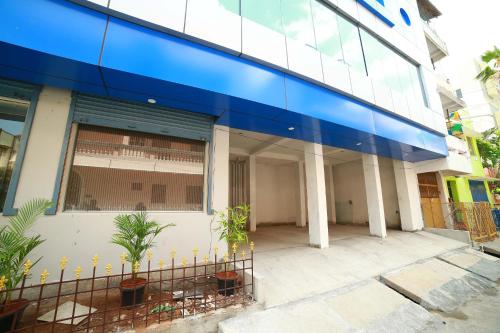 a large building with a blue stripe on it at SAPPHIRE INN in Puducherry