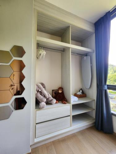 a childs room with shelves and stuffed animals at Mountain View Suite at The Valley Khaoyai in Ban Huai Sok Noi
