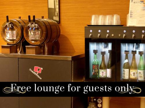 a coffee queue with bottles of wine on a counter at Hotel Nikko Nara in Nara