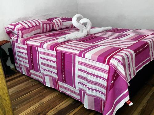 Una cama o camas en una habitación de Apartaestudio cerca a parque Zapatoca