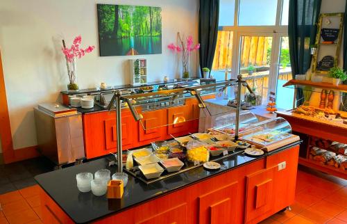 a buffet line with many different food items at Best Western Spreewald in Lübbenau
