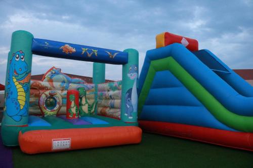 a playground with a water slide and an inflatable at Lina Dreamland Resort in Billah