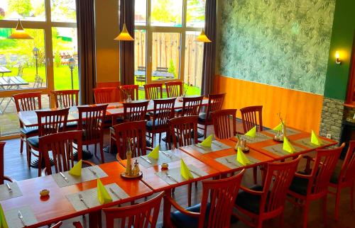 a row of tables and chairs in a restaurant at Best Western Spreewald in Lübbenau